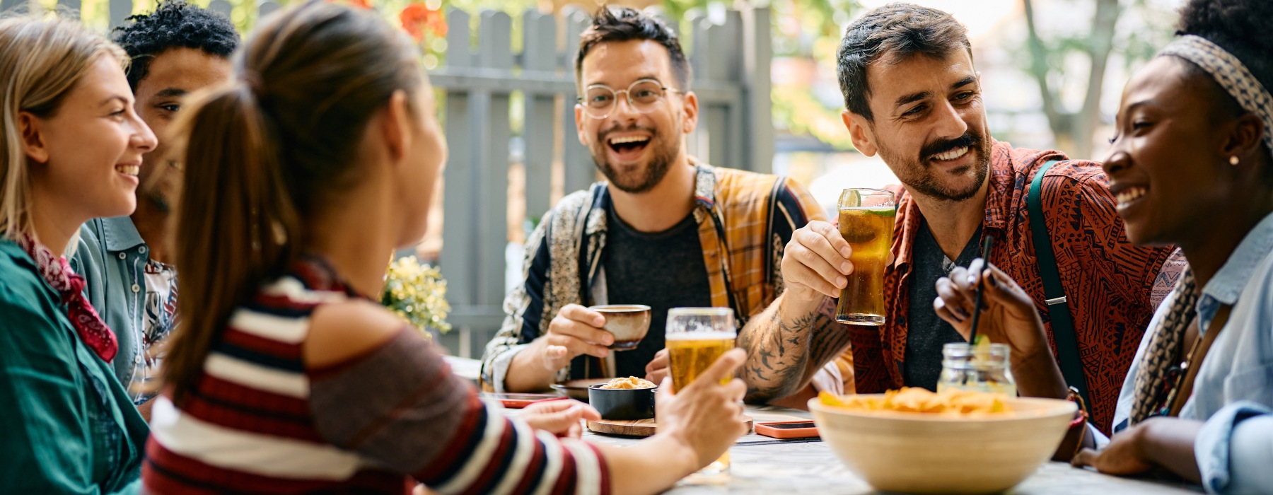 Vibrant community life with a variety of dining options a group of people drinking and eating